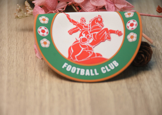 Raised Silicone Logo screen printed patches On A White Microfibre Background For Garments